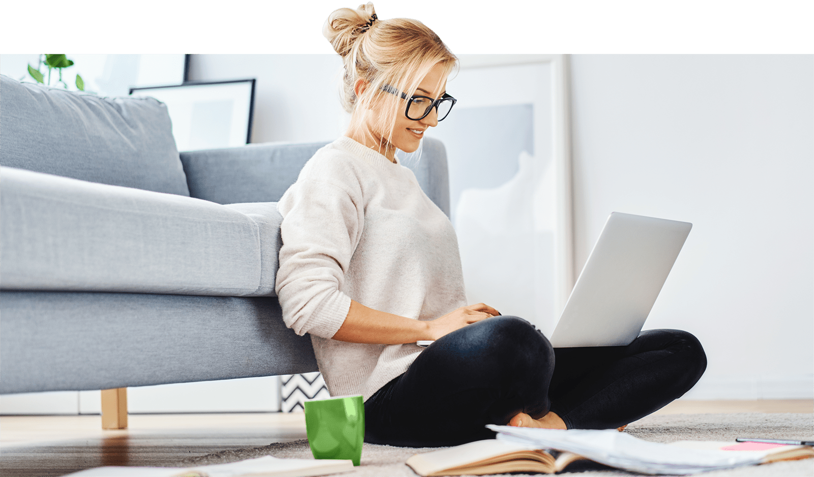 Man holding green mug on the phone